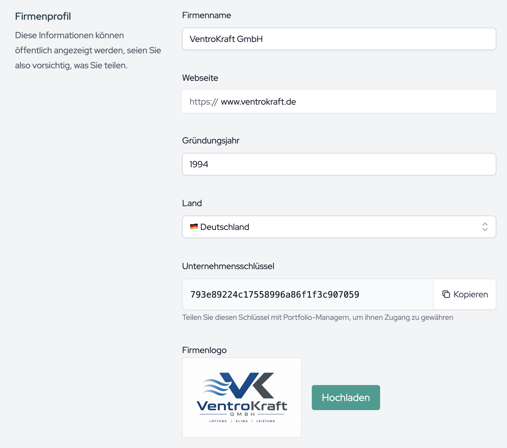 The Company Profile section with master data, the copyable company key and the logo upload.